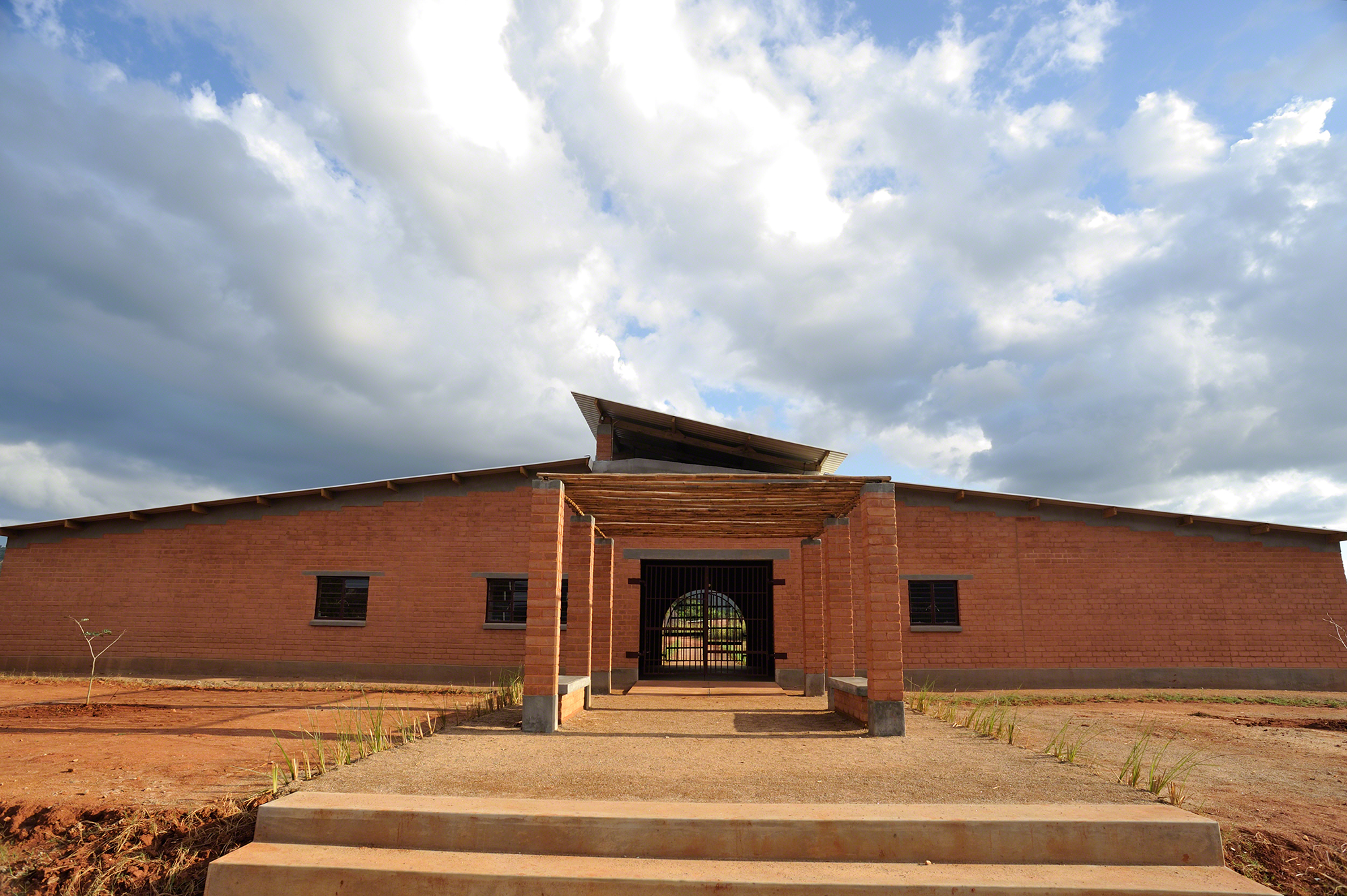 earthen red walls with pergola