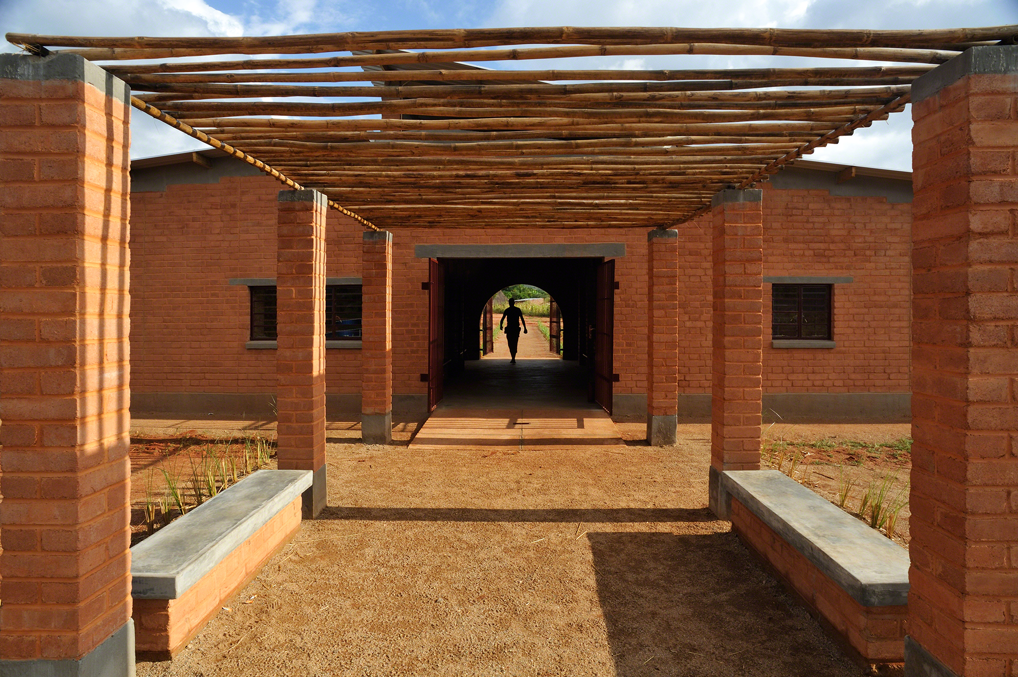 earthen red walls with pergola