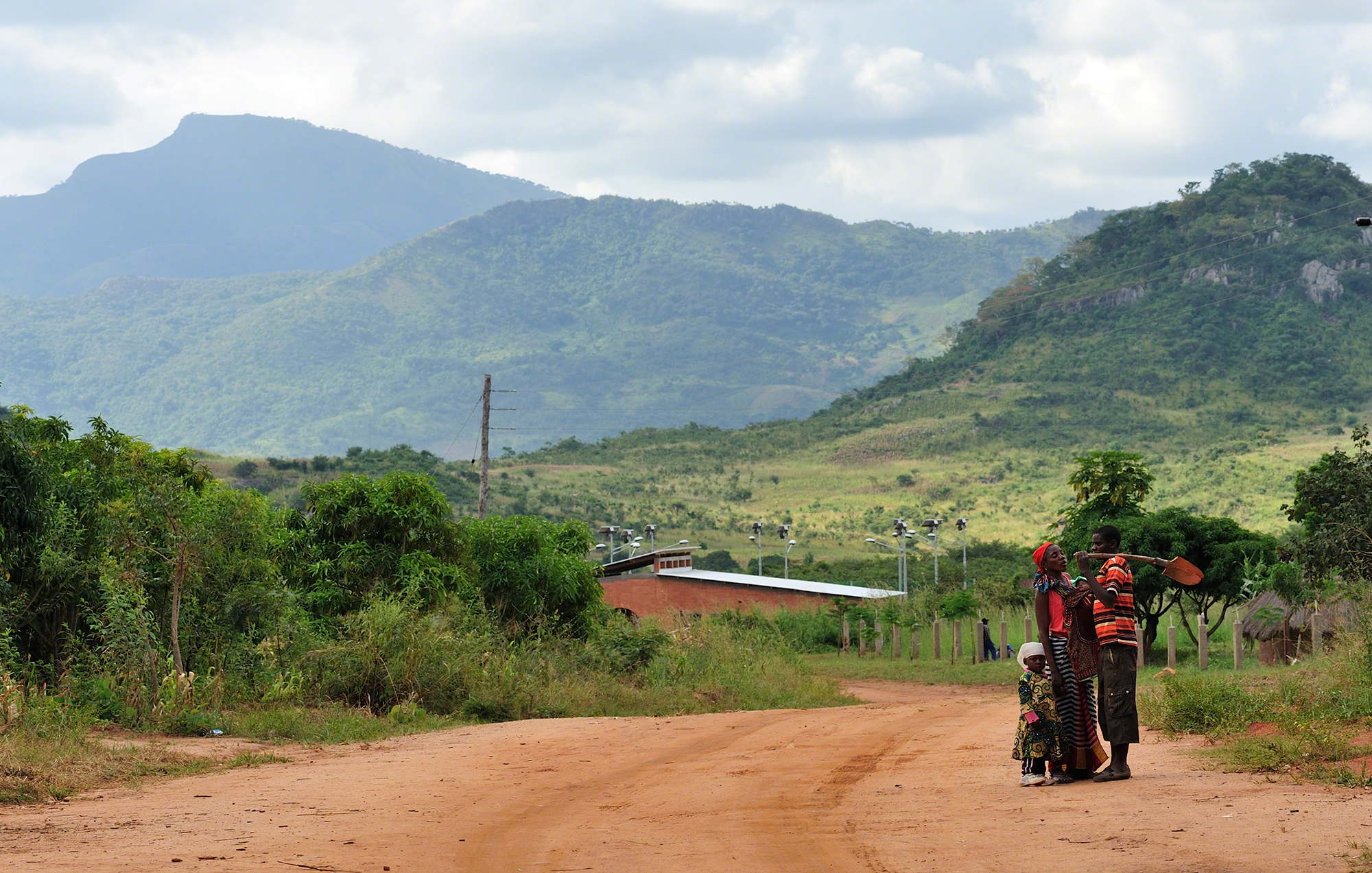 ffh Manica community center Mozambique sustainable architecture mason and family