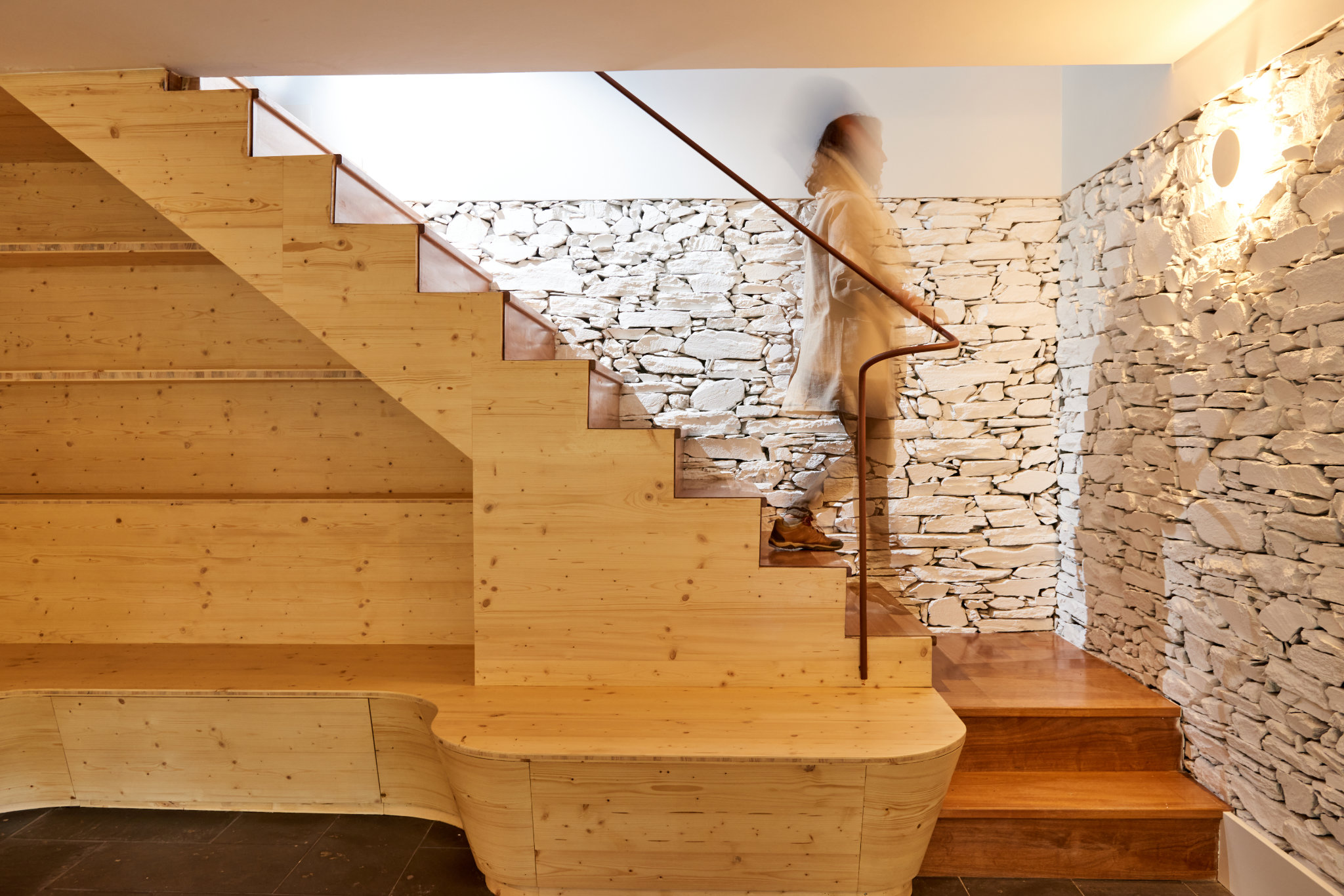 Eco-friendly renovation of a 30-year-old schist house in northern Portugal using sustainable materials.