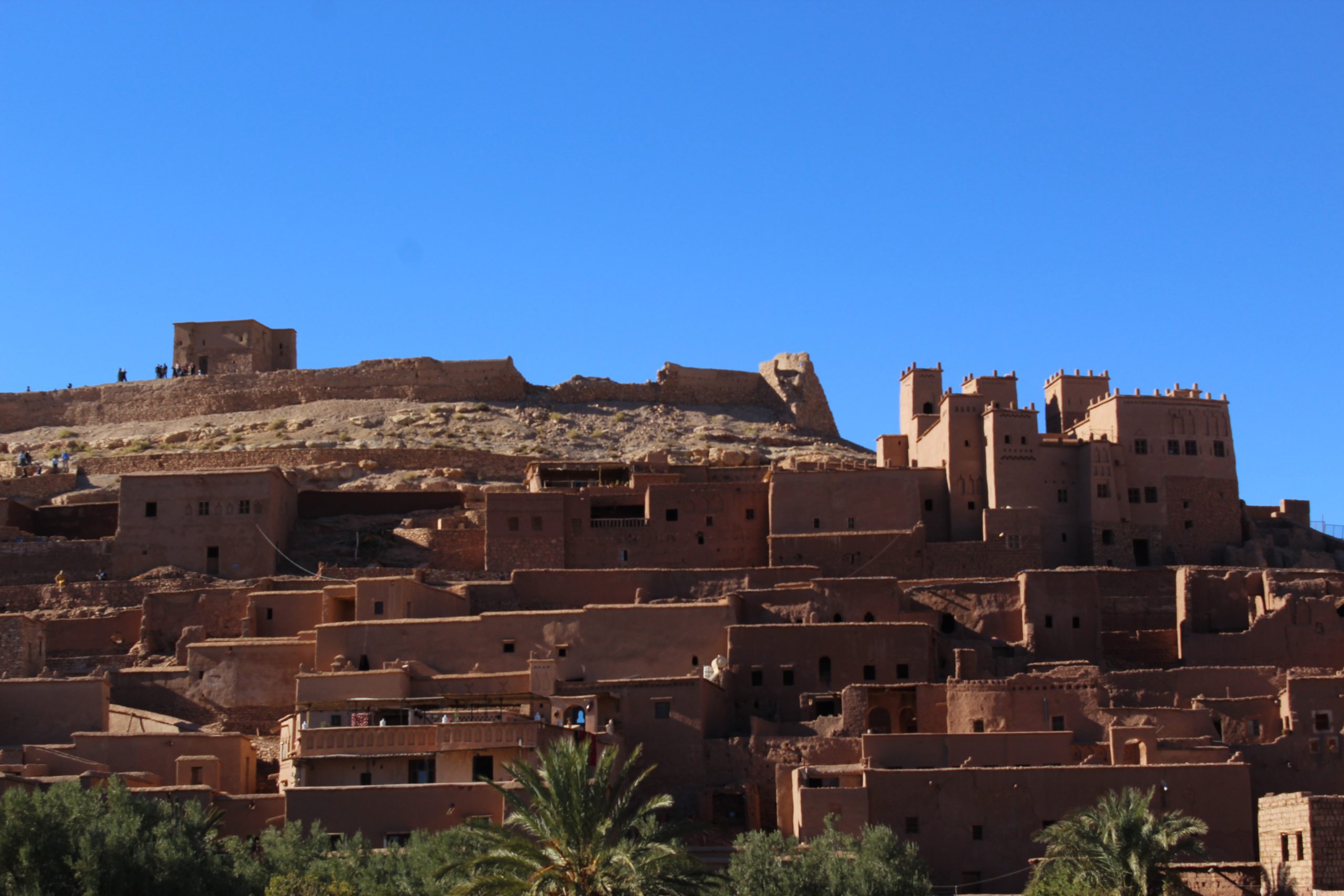 View of Aït Ben Haddou kasbah in Morocco, traditional adobe houses on the hillside.