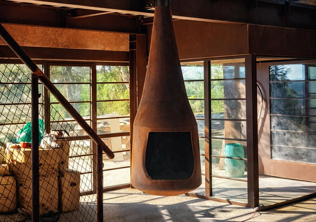 close up Steel suspended fireplace installed in interior space, Project Outeiro, CAS Studio
