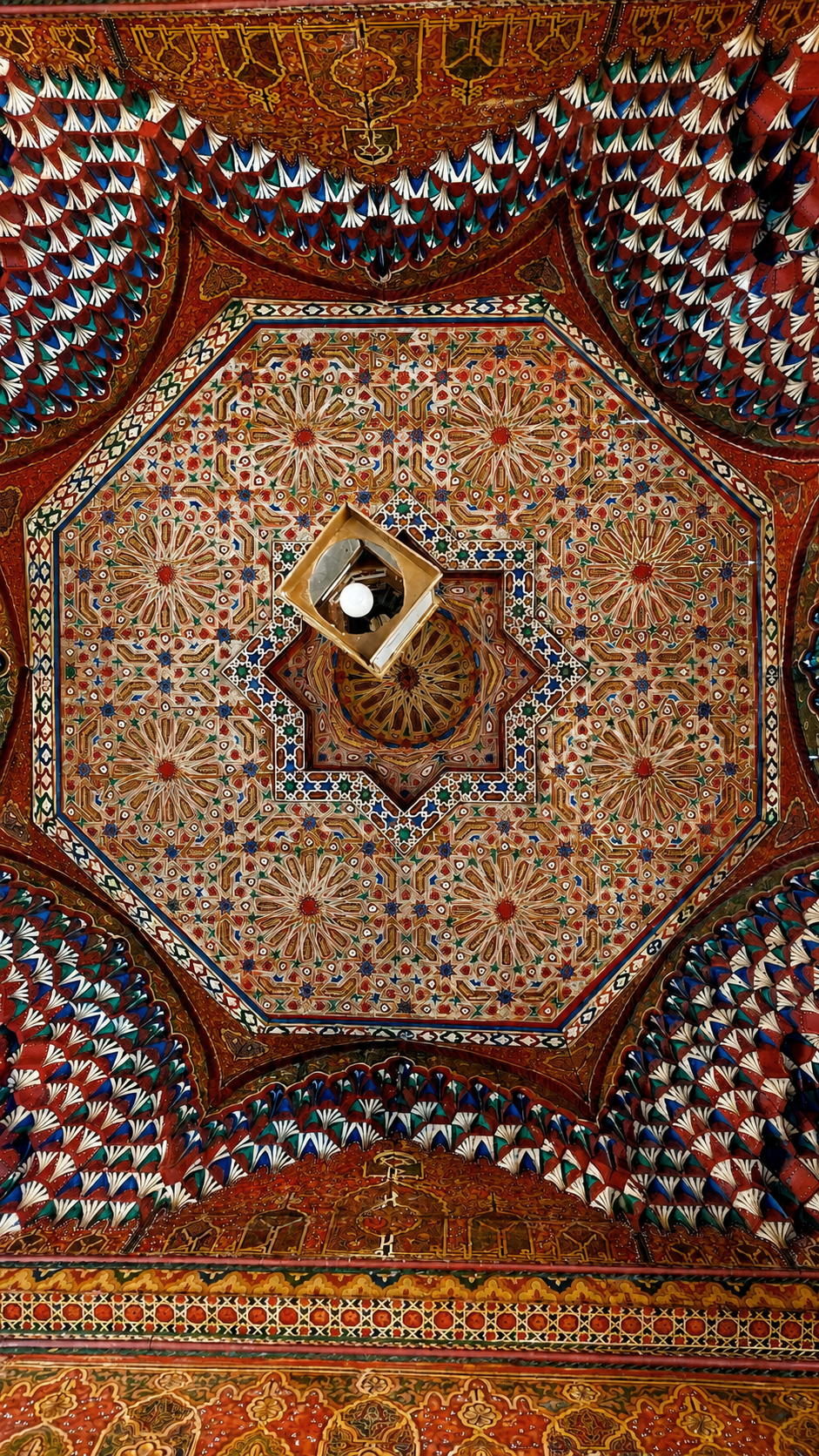 Painted cedar wood ceiling with geometric pattern at Palais Bahia, Marrakech.
